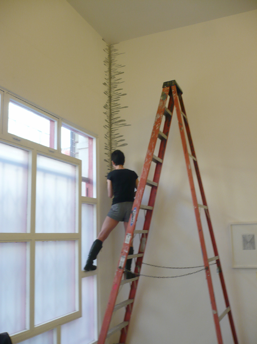 Katia Santibanez making a wall drawing @ Jancar Gallery (2009)